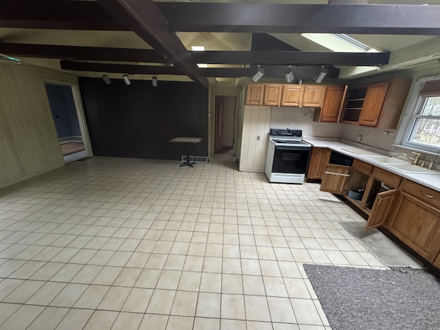 kitchen with electric range, brown cabinetry, light countertops, open shelves, and a sink