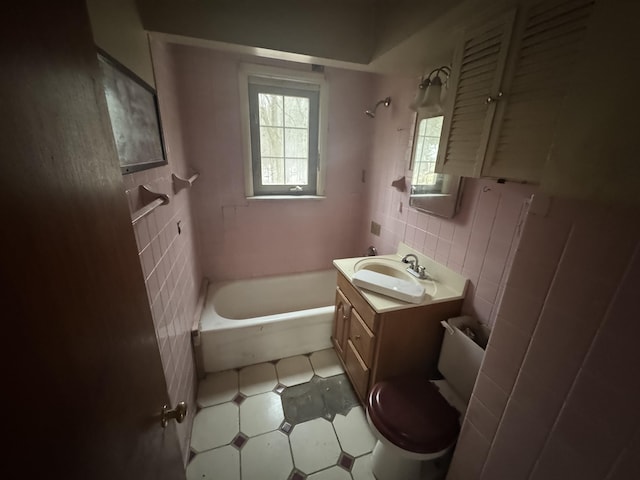 bathroom with backsplash, tile walls, toilet, and vanity