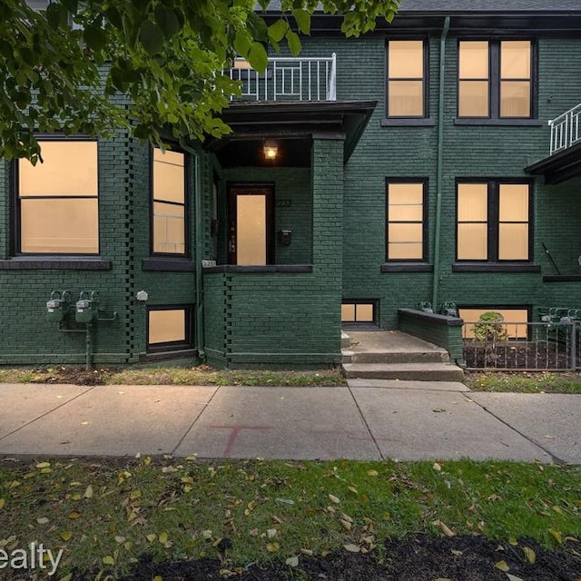 exterior space with brick siding