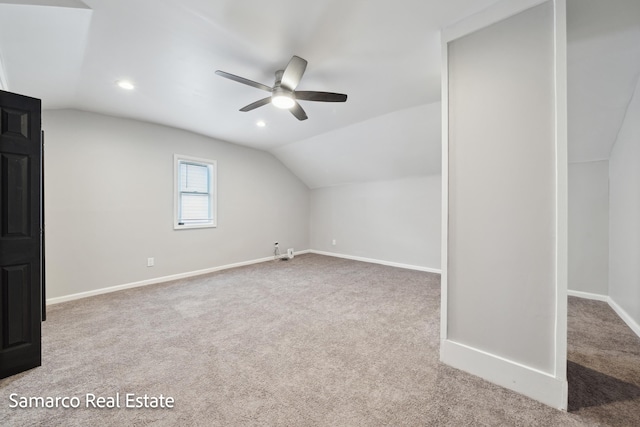 additional living space featuring carpet floors, lofted ceiling, baseboards, and recessed lighting