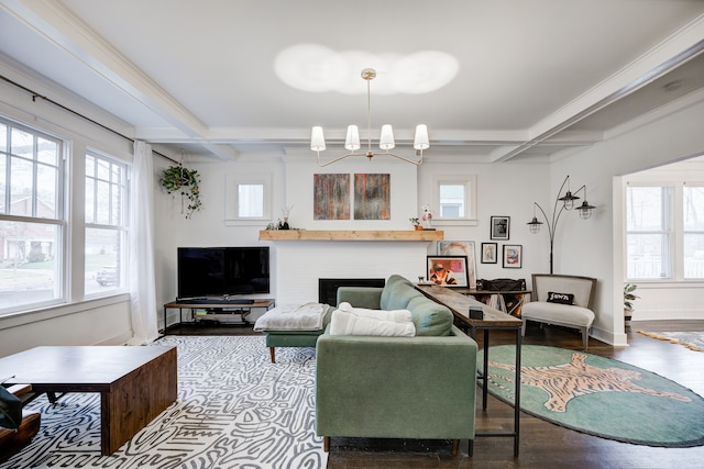 living area with a fireplace, beamed ceiling, coffered ceiling, and wood finished floors