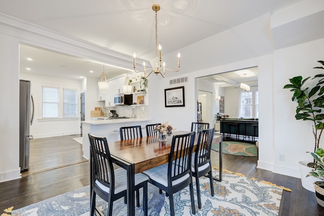 dining space with baseboards, visible vents, a chandelier, and dark wood-type flooring