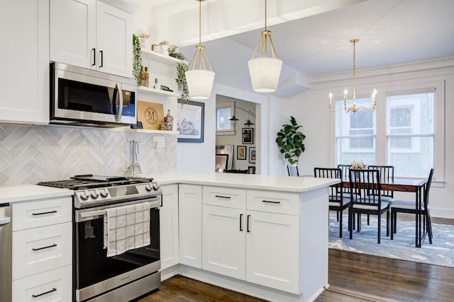 kitchen with open shelves, light countertops, appliances with stainless steel finishes, dark wood-type flooring, and a peninsula