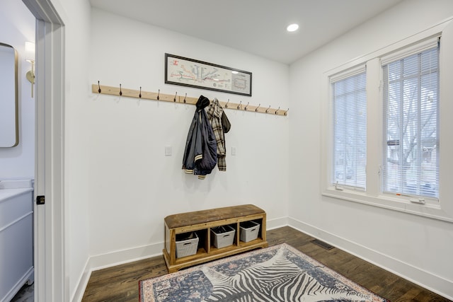 mudroom with recessed lighting, dark wood finished floors, and baseboards