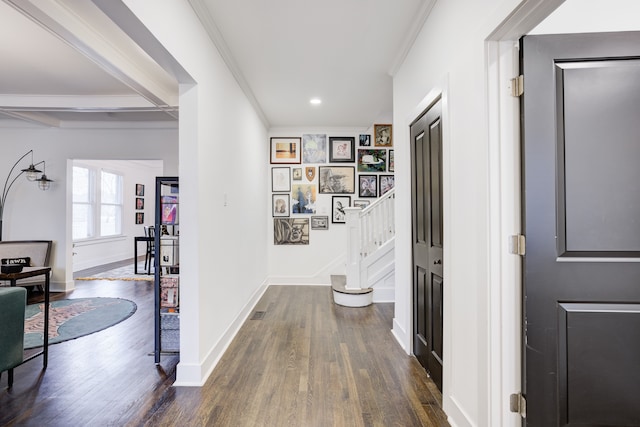 corridor featuring stairs, baseboards, dark wood finished floors, and crown molding