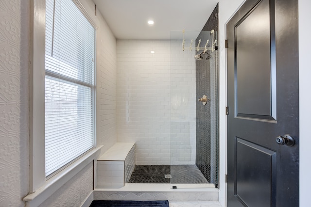 bathroom featuring recessed lighting and a shower stall