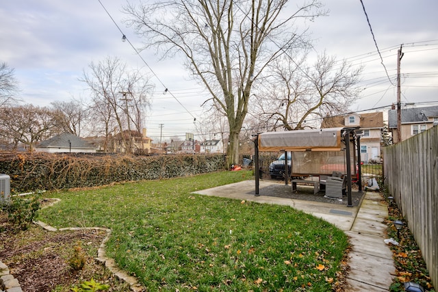 view of yard featuring a patio and a fenced backyard