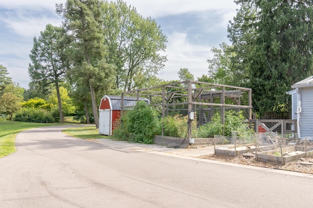 exterior space with an outbuilding and a vegetable garden