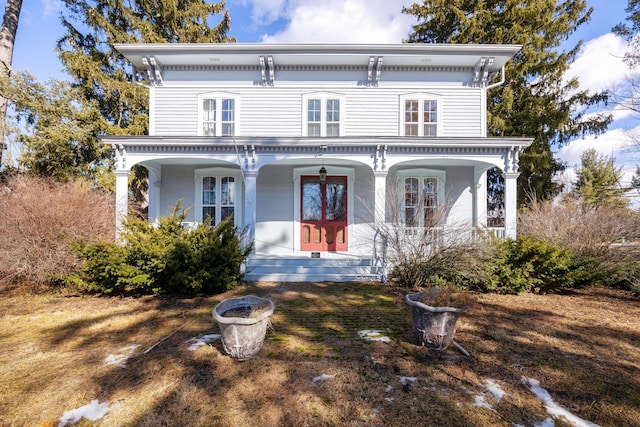 italianate home featuring a porch