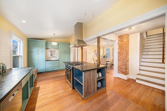 kitchen featuring open shelves, dark countertops, island range hood, gas range, and green cabinetry