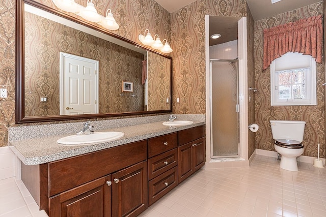 bathroom with toilet, wallpapered walls, a shower stall, and a sink