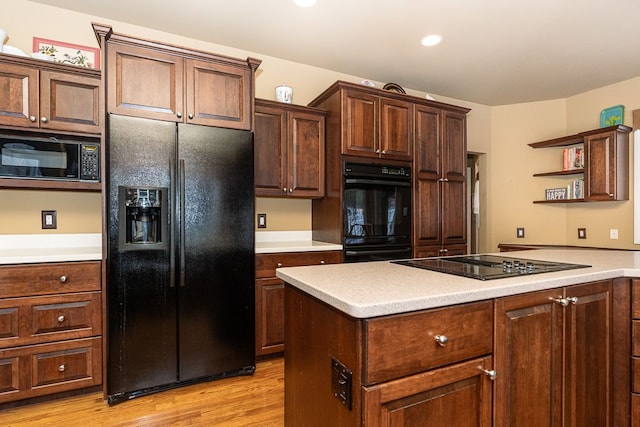 kitchen with black appliances, light wood-style flooring, open shelves, and light countertops