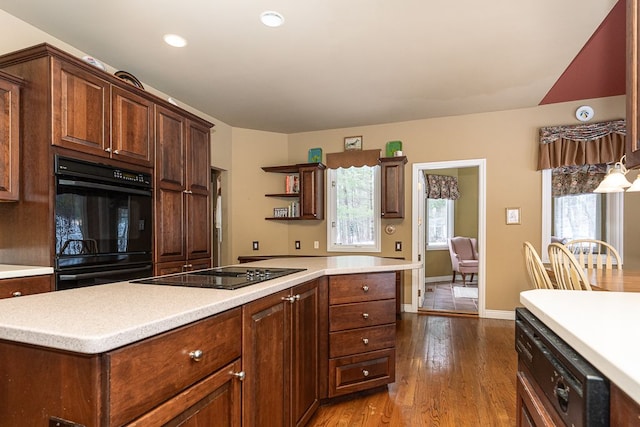 kitchen with black appliances, dark wood-type flooring, open shelves, and light countertops