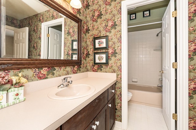 full bathroom featuring tile patterned flooring, toilet, vanity, tub / shower combination, and wallpapered walls