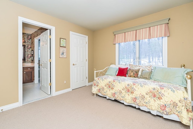 bedroom featuring carpet floors and baseboards