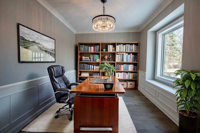 home office featuring wainscoting, a healthy amount of sunlight, an inviting chandelier, and a decorative wall