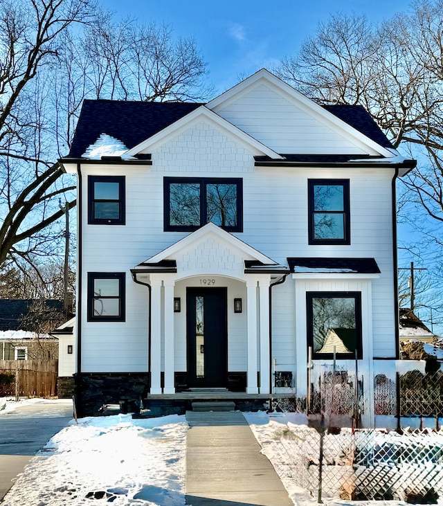 view of front of property featuring fence