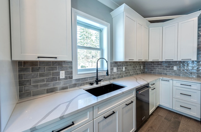 kitchen with white cabinets, a sink, dark wood finished floors, light stone counters, and dishwasher