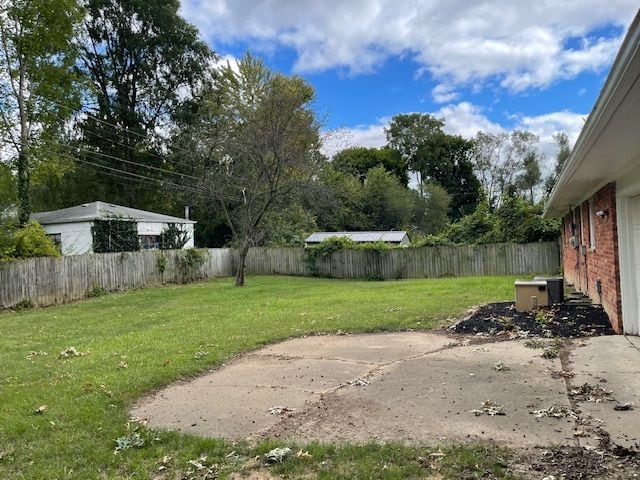 view of yard with a patio area and a fenced backyard