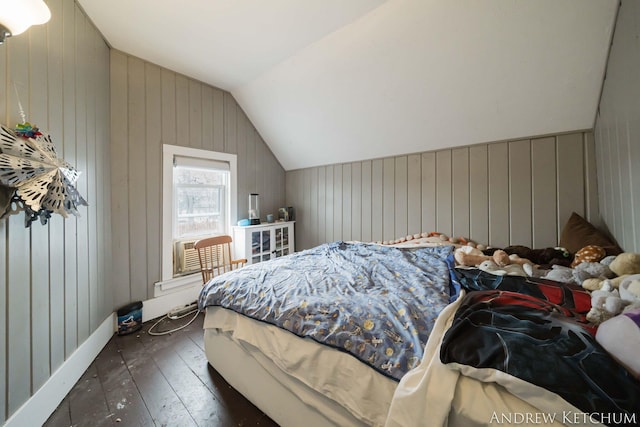 bedroom with lofted ceiling and hardwood / wood-style flooring