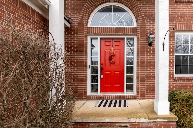 entrance to property with brick siding