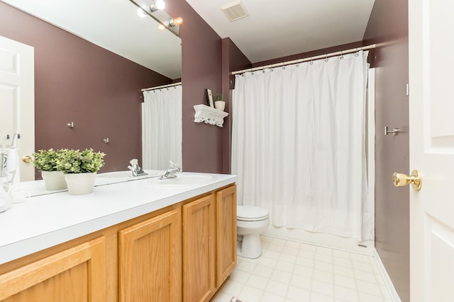 full bath featuring toilet, vanity, visible vents, and tile patterned floors