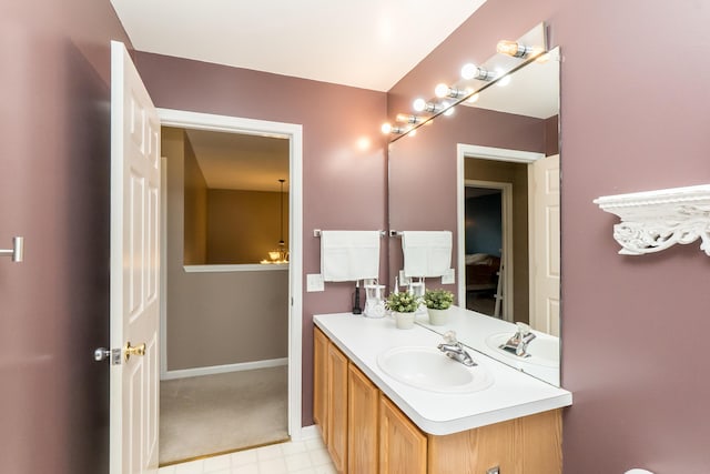 bathroom featuring vanity and baseboards