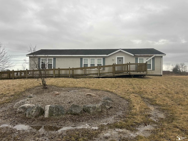 manufactured / mobile home featuring fence and a deck