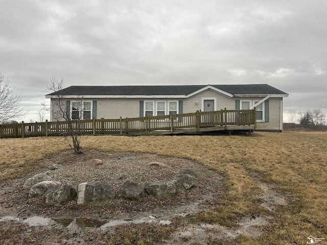 manufactured / mobile home featuring fence and a deck