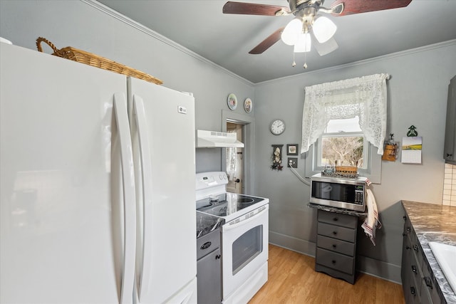 kitchen with under cabinet range hood, white appliances, a ceiling fan, light wood finished floors, and crown molding