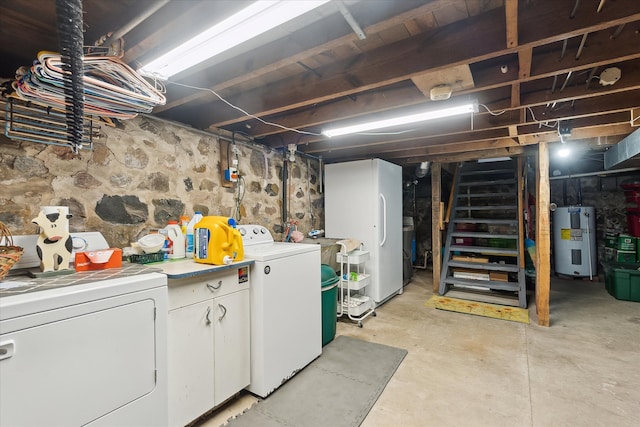 unfinished basement featuring stairs, water heater, washer and dryer, and freestanding refrigerator