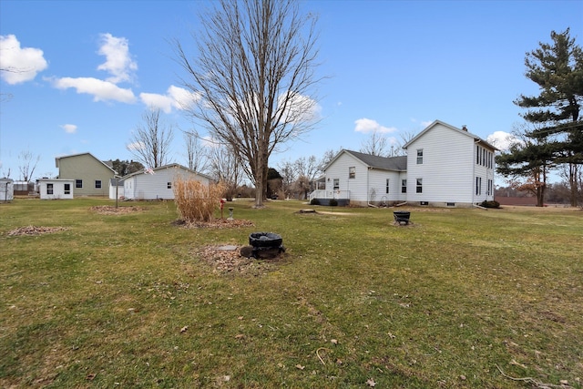 view of yard with an outdoor fire pit