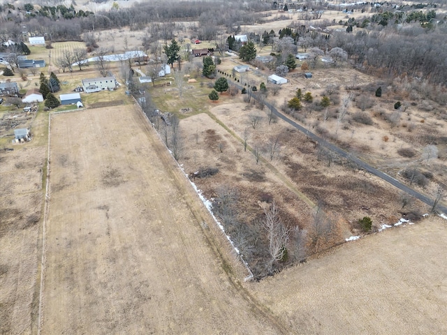 birds eye view of property with a rural view