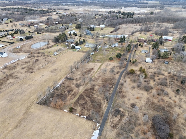 birds eye view of property with a rural view