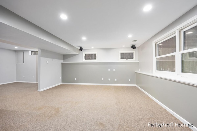 finished basement with carpet, baseboards, and recessed lighting