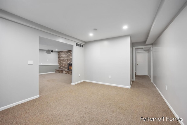 finished below grade area featuring recessed lighting, carpet, visible vents, and baseboards