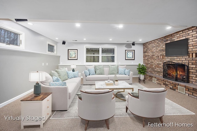 carpeted living room with baseboards, a fireplace, and recessed lighting