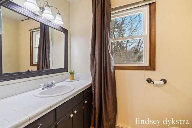 bathroom with plenty of natural light and vanity