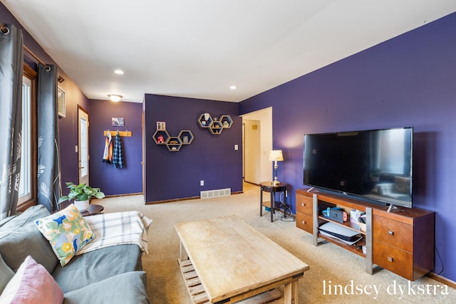 carpeted living room with baseboards, visible vents, and recessed lighting