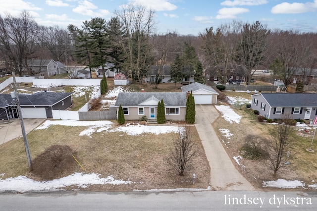 snowy aerial view featuring a residential view