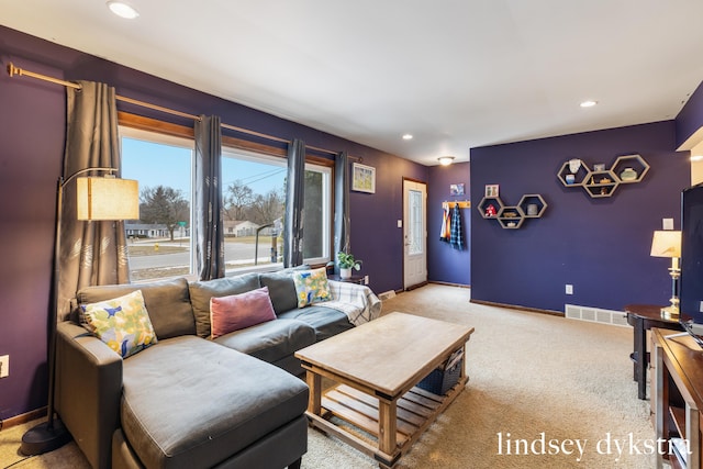 living room with light carpet, recessed lighting, visible vents, and baseboards