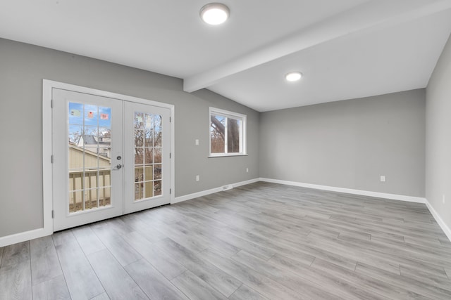 unfurnished room with vaulted ceiling with beams, french doors, wood finished floors, and baseboards