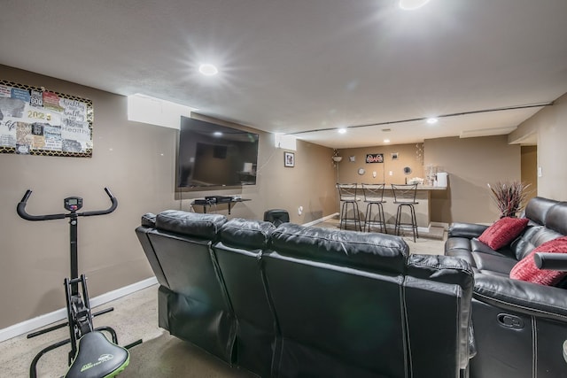 home theater room with recessed lighting, indoor bar, and baseboards