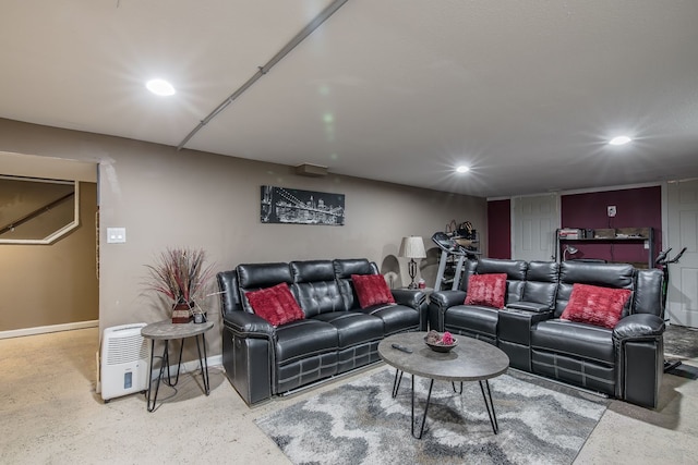 living room with baseboards and recessed lighting