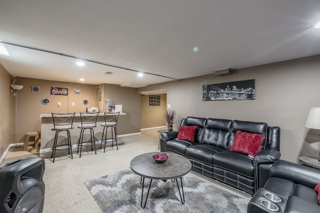 living room with recessed lighting, a dry bar, and baseboards