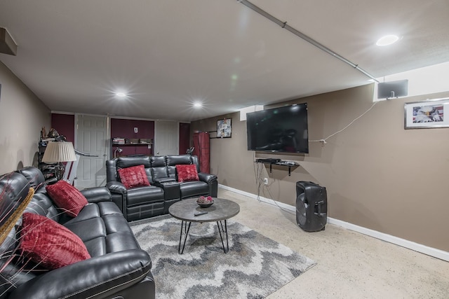 living area featuring recessed lighting and baseboards