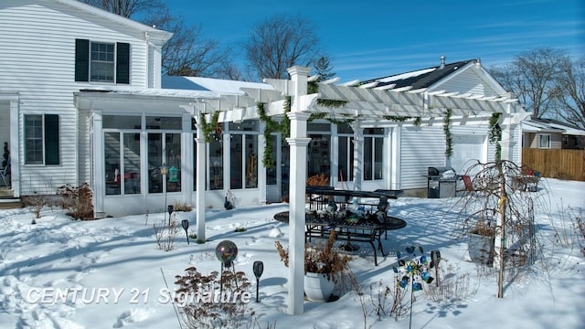 exterior space with a sunroom, grilling area, an attached garage, fence, and a pergola