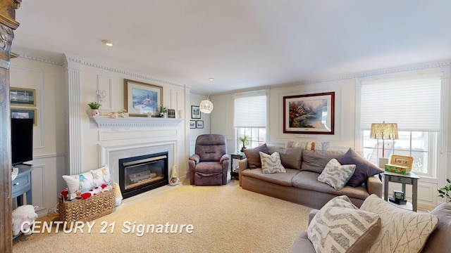 carpeted living area featuring a glass covered fireplace