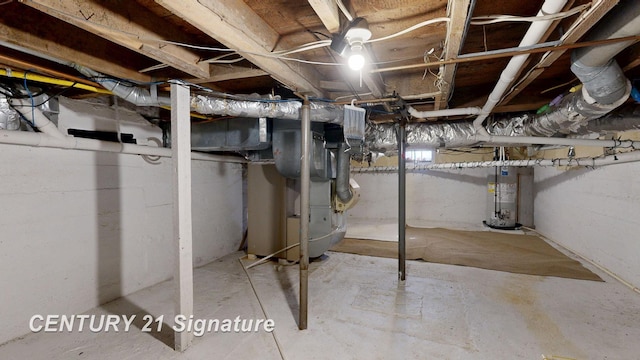 unfinished basement featuring gas water heater and heating unit