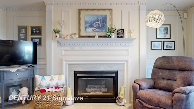 sitting room with a glass covered fireplace